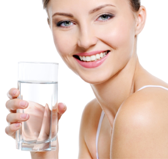 Pretty woman holding a glass of water