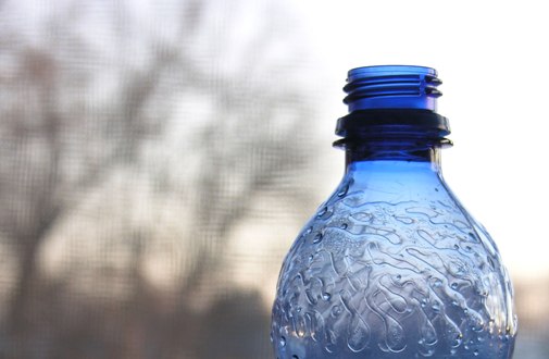 Open bottle of drinking water