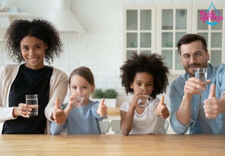 Family drinking water with thumbs up