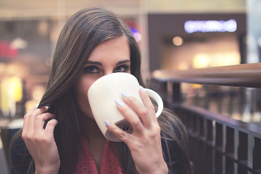 Woman drinking a hot beverage